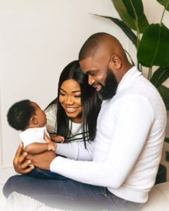 "Why Do You Feel Comfortable Trolling Babies" Reactions As Mercy Chinwo & Husband Reveals Son's Face (PHOTOS)