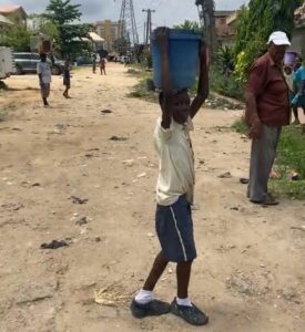 Student carrying concrete 