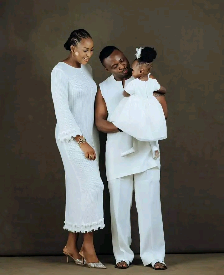 A photo of Funnybone, his wife and their daughter